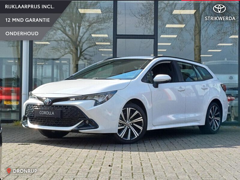 Wit Gebruikt 2024 Toyota Corolla Hybrid Active Stationwagen | € 31.995 - Afbeelding 1/4