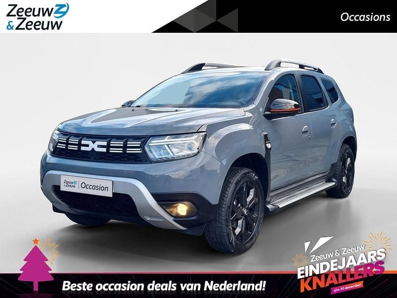 Stadsgrijs kpw Gebruikt 2022 Dacia Duster Extreme SUV | € 18.435 (Eerlijke prijs) - Afbeelding 1/4