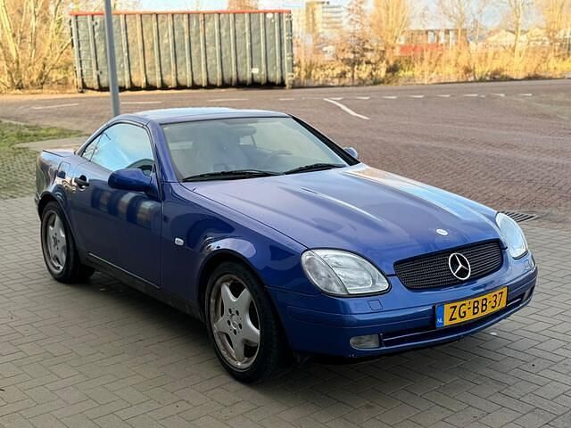 Blauw Occasion 1999 Mercedes SLK230 Cabriolet | € 1.495 (Goede deal) - Afbeelding 1/4