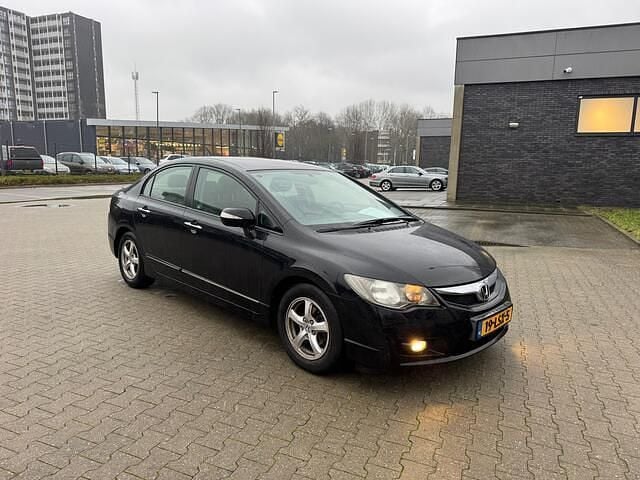 Zwart (metallic) Occasion 2010 Honda Civic Elegance Sedan | € 2.450 - Afbeelding 1/4