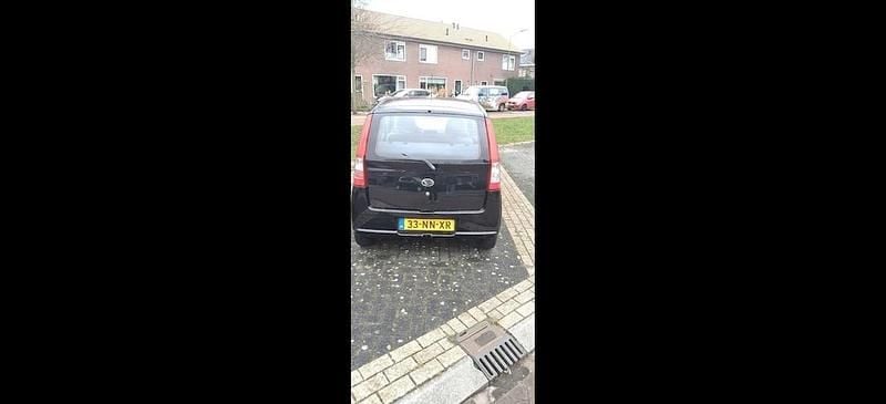 Occasion Daihatsu Cuore 58 PK (42 kW) 2004 Zwart Hatchback