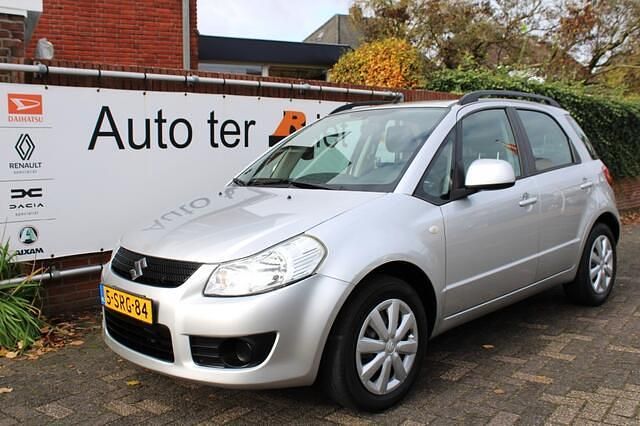 Grijs Gebruikt 2010 Suzuki SX4 Comfort SUV | € 7.500 (Eerlijke prijs) - Afbeelding 1/4