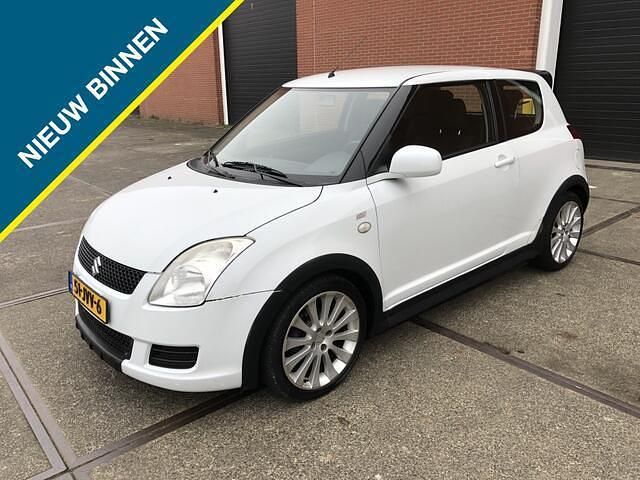 Wit (metallic) Gebruikt 2009 Suzuki Swift Comfort Hatchback | € 3.100 (Iets duurder) - Afbeelding 1/4