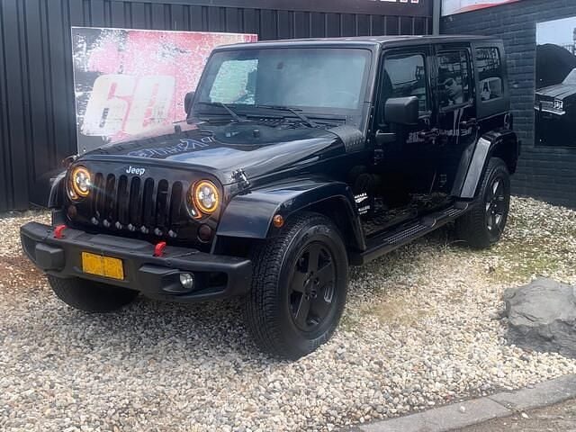 Zwart Gebruikt 2009 Jeep Wrangler Unlimited Sahara SUV | € 24.999 - Afbeelding 1/4