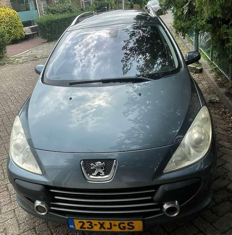 Grijs Gebruikt 2007 Peugeot 307 Premium Stationwagen | € 700 (Goede deal) - Afbeelding 1/4