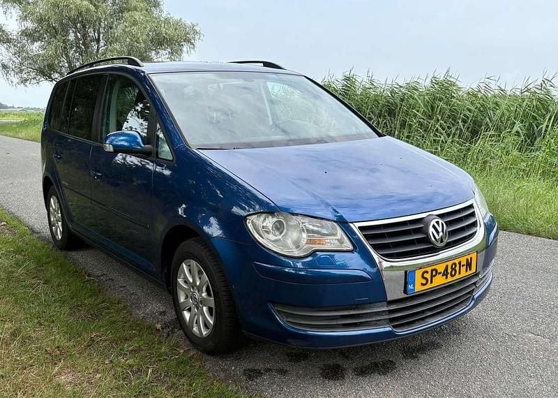Blauw Gebruikt 2009 VW Touran Highline MPV | € 4.500 (Iets duurder) - Afbeelding 1/4