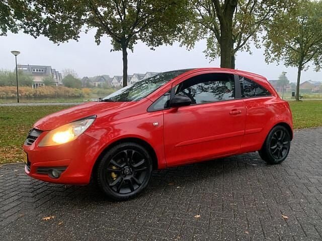 Rood Gebruikt 2006 Opel Corsa Essentia Hatchback | € 1.695 (Eerlijke prijs) - Afbeelding 1/4