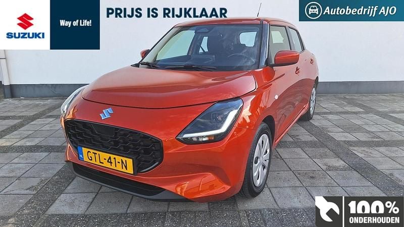 Oranje (metallic) Gebruikt 2024 Suzuki Swift Comfort Hatchback | € 18.950 (Eerlijke prijs) - Afbeelding 1/4
