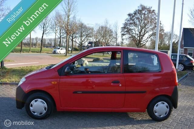 Rood Gebruikt 2006 Daihatsu Cuore Hatchback | € 999 (Goede deal) - Afbeelding 1/4
