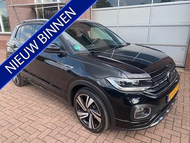Zwart Gebruikt 2023 VW T-Cross R-line SUV | € 28.350 (Eerlijke prijs) - Afbeelding 1/4