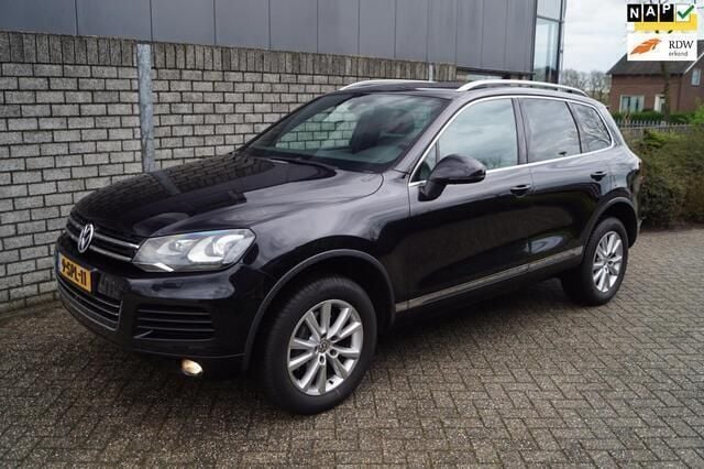 Zwart, metallic lak Gebruikt 2012 VW Touareg Exclusive SUV | € 18.450 - Afbeelding 1/4
