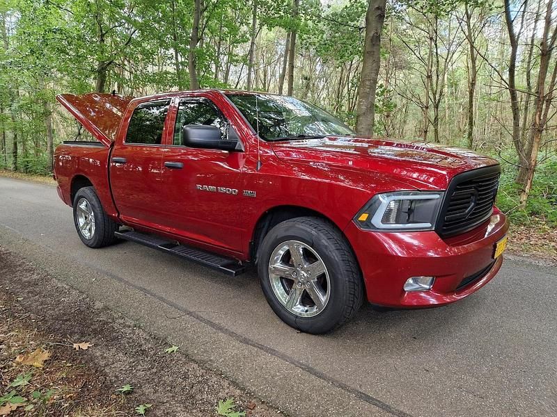 Rood (metallic) Gebruikt 2012 Dodge Ram Pickup | € 15.995 - Afbeelding 1/4