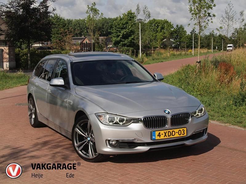 Grijs Gebruikt 2014 BMW 320 Executive Stationwagen | € 17.490 - Afbeelding 1/4