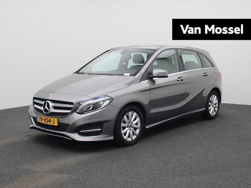 Grijs Gebruikt 2018 Mercedes B180 Ambition MPV | € 17.900 (Eerlijke prijs) - Afbeelding 1/4