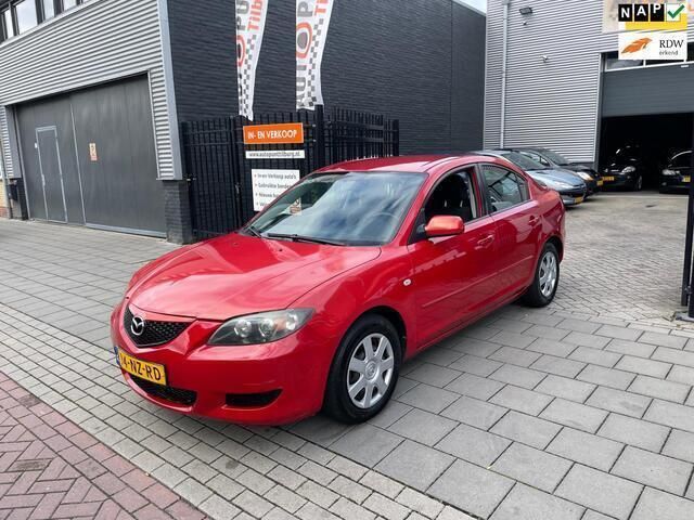 Rood, metallic lak Gebruikt 2004 Mazda 3 Touring Sedan | € 2.999 (Duur) - Afbeelding 1/4