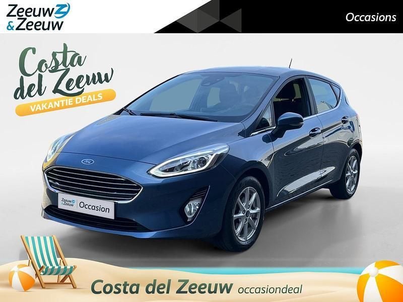 Blue metallic (pn4ft) Gebruikt 2020 Ford Fiesta Titanium Hatchback | € 12.930 (Goede deal) - Afbeelding 1/4
