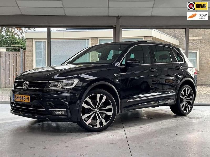 Zwart Gebruikt 2018 VW Tiguan Highline SUV | € 27.950 (Eerlijke prijs) - Afbeelding 1/4