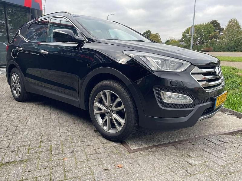 Zwart (metallic) Gebruikt 2013 Hyundai Santa Fe SUV | € 18.950 - Afbeelding 1/4