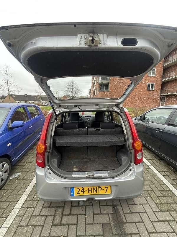 Occasion Daihatsu Cuore 69 PK (50 kW) 2009 Grijs Hatchback