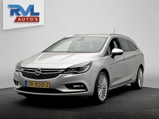 Grijs (metallic) Gebruikt 2019 Opel Astra Edition Stationwagen | € 12.900 (Eerlijke prijs) - Afbeelding 1/4