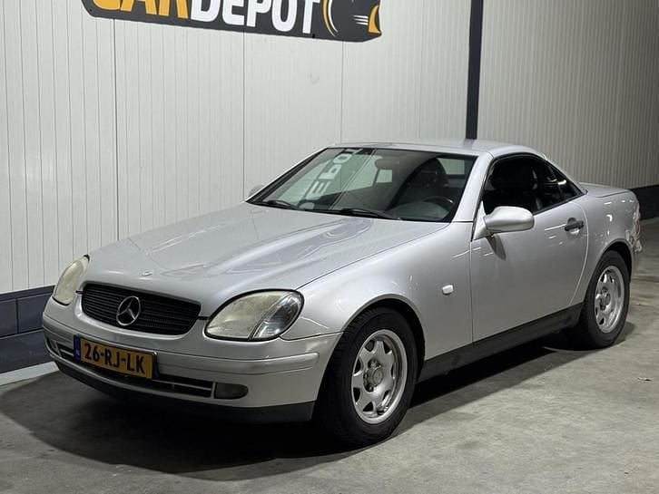 Grijs Occasion 1999 Mercedes SLK200 Cabriolet | € 2.798 (Eerlijke prijs) - Afbeelding 1/4