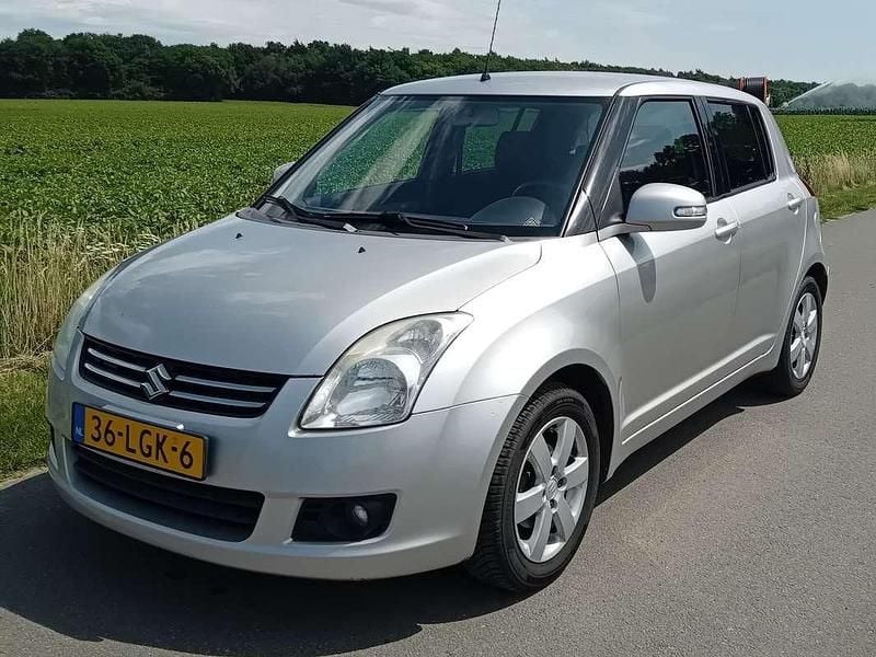 Grijs Gebruikt 2010 Suzuki Swift Limited | € 2.599 (Super prijs) - Afbeelding 1/4