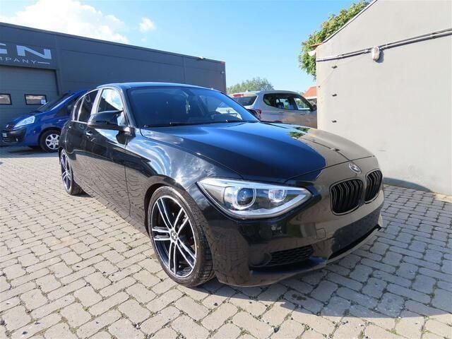 Zwart Gebruikt 2012 BMW 114 Hatchback | € 5.900 (Super prijs) - Afbeelding 1/4