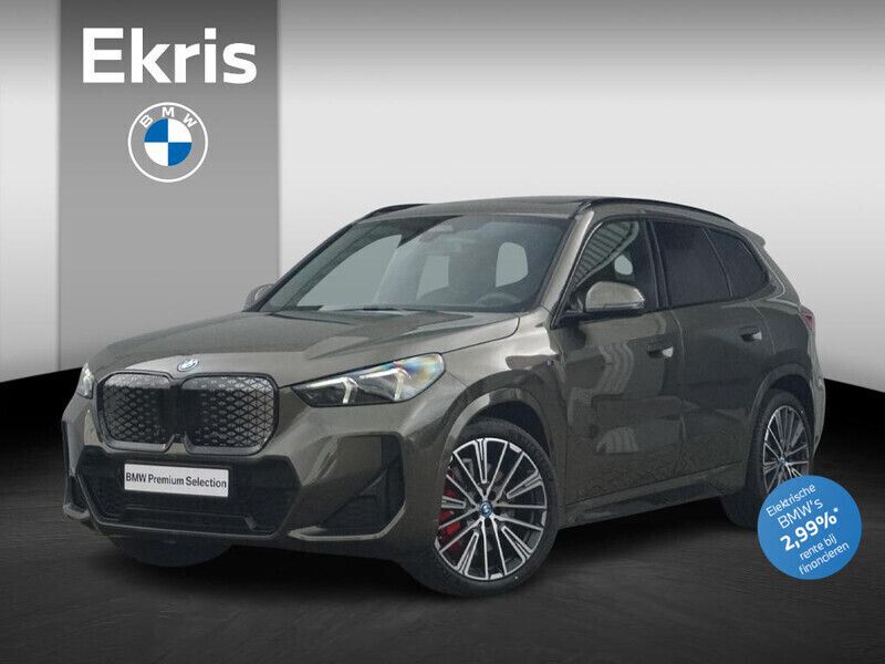 Groen Gebruikt 2025 BMW iX1 M Sport SUV | € 53.900 - Afbeelding 1/4