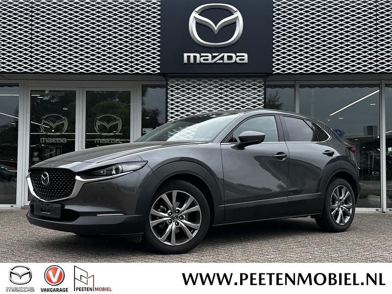 Machine gray metallic (46g) Gebruikt 2020 Mazda CX-30 Luxury SUV | € 24.995 (Iets duurder) - Afbeelding 1/2