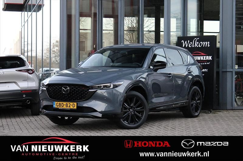 Poly metal grey (grijs mica) Occasion 2024 Mazda CX-5 Homura-Line SUV | € 38.700 (Eerlijke prijs) - Afbeelding 1/4