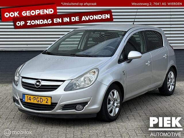 Grijs Gebruikt 2011 Opel Corsa Cosmo Hatchback | € 2.999 (Eerlijke prijs) - Afbeelding 1/3