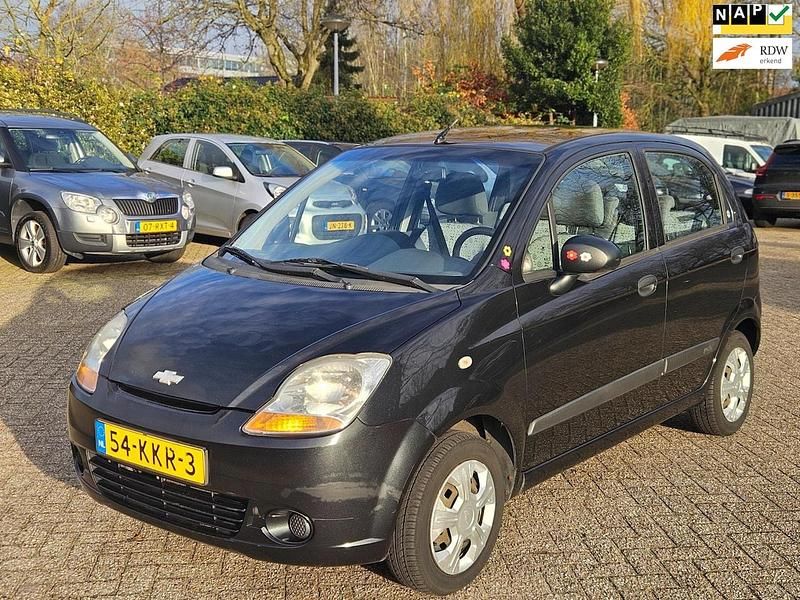 Zwart (metallic) Gebruikt 2009 Chevrolet Matiz Hatchback | € 899 (Eerlijke prijs) - Afbeelding 1/4