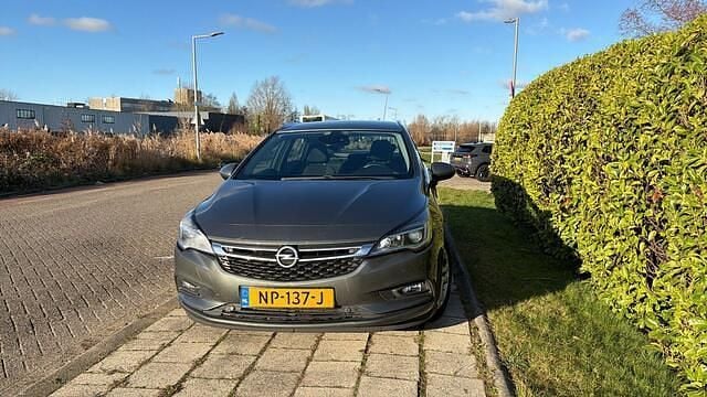 Grijs Gebruikt 2017 Opel Astra Business Stationwagen | € 3.950 (Duur) - Afbeelding 1/4