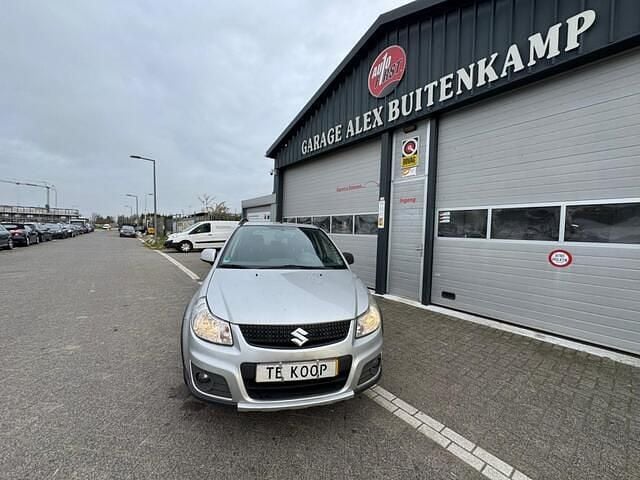 Grijs Gebruikt 2010 Suzuki SX4 Exclusive MPV | € 2.495 (Super prijs) - Afbeelding 1/4