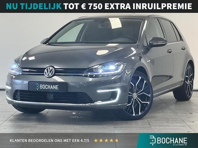 Metallic indium grey (x3x3) Gebruikt 2019 VW e-Golf Hatchback | € 13.850 (Eerlijke prijs) - Afbeelding 1/4