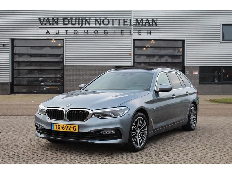 Grijs Occasion 2018 BMW 520 Executive Stationwagen | € 19.950 (Goede deal) - Afbeelding 1/4