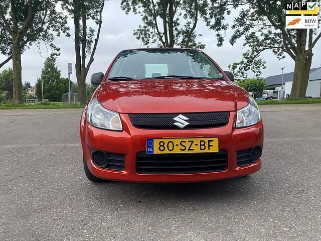 Oranje Gebruikt 2006 Suzuki SX4 MPV | € 3.500 (Eerlijke prijs) - Afbeelding 1/4