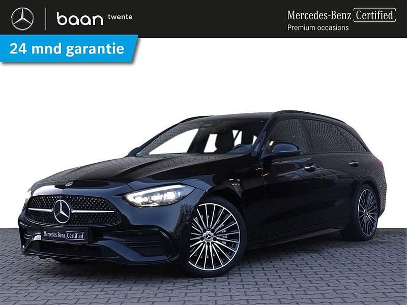 Zwart (metallic) Occasion 2022 Mercedes C200 AMG line Stationwagen | € 38.900 (Eerlijke prijs) - Afbeelding 1/4