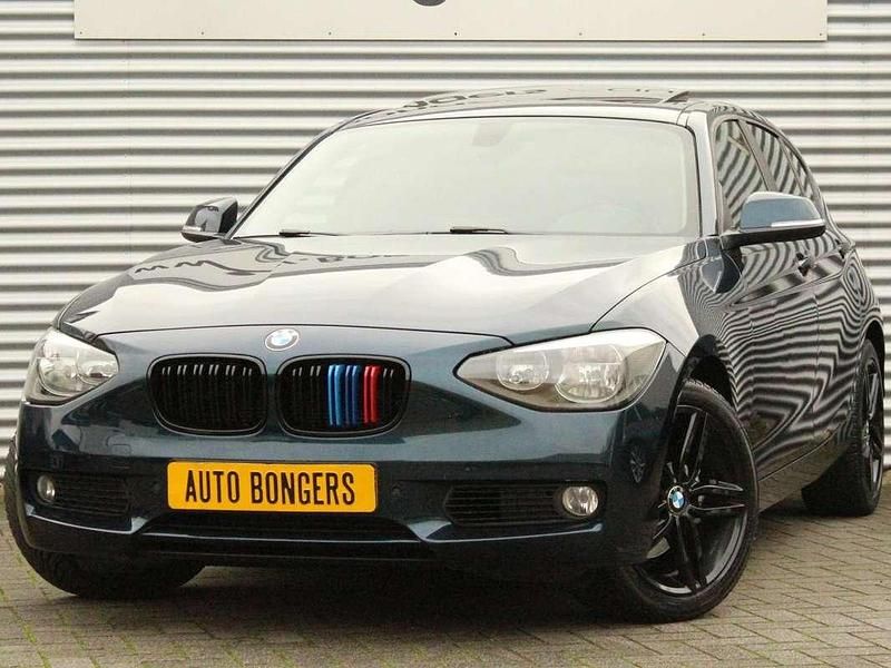 Blauw (metallic) Gebruikt 2012 BMW 118 Hatchback | € 7.250 (Super prijs) - Afbeelding 1/4