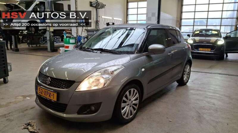 Grijs, metallic lak Gebruikt 2012 Suzuki Swift Exclusive Hatchback | € 4.999 (Eerlijke prijs) - Afbeelding 1/3