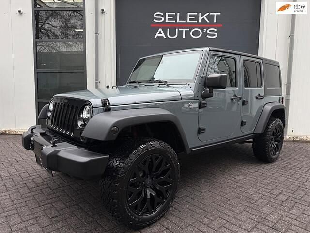 Grijs Occasion 2015 Jeep Wrangler Unlimited Sahara SUV | € 39.950 (Eerlijke prijs) - Afbeelding 1/4