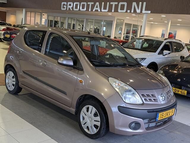 Beige (metallic) Occasion 2009 Nissan Pixo Acenta Hatchback | € 3.444 (Eerlijke prijs) - Afbeelding 1/4