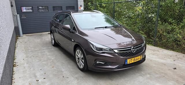 Bruin Gebruikt 2016 Opel Astra Business Edition Stationwagen | € 7.499 - Afbeelding 1/4