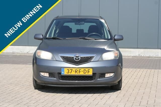 Grijs Gebruikt 2005 Mazda 2 Touring MPV | € 1.499 (Eerlijke prijs) - Afbeelding 1/4