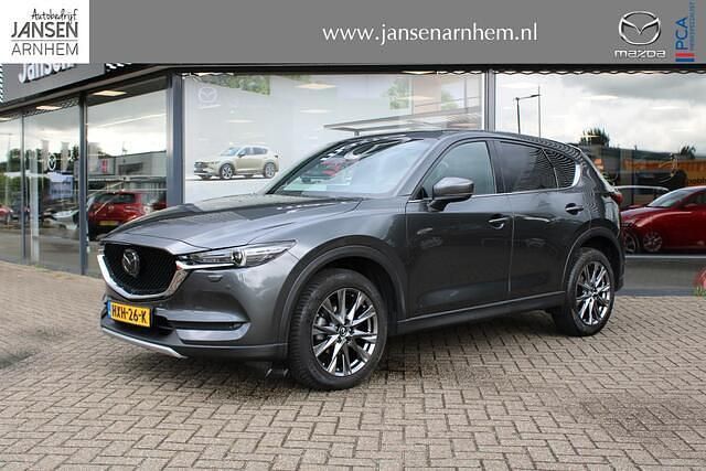 Machine gray metallic (46g) (donker grijs) Gebruikt 2020 Mazda CX-5 Signature SUV | € 32.900 (Eerlijke prijs) - Afbeelding 1/4