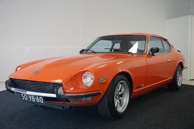 Oranje Occasion 1977 Nissan Datsun Coupé | € 29.500 - Afbeelding 1/4