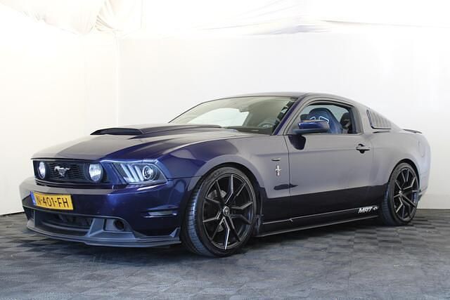 Blauw, metallic lak Gebruikt 2012 Ford Mustang Coupé | € 24.999 - Afbeelding 1/4