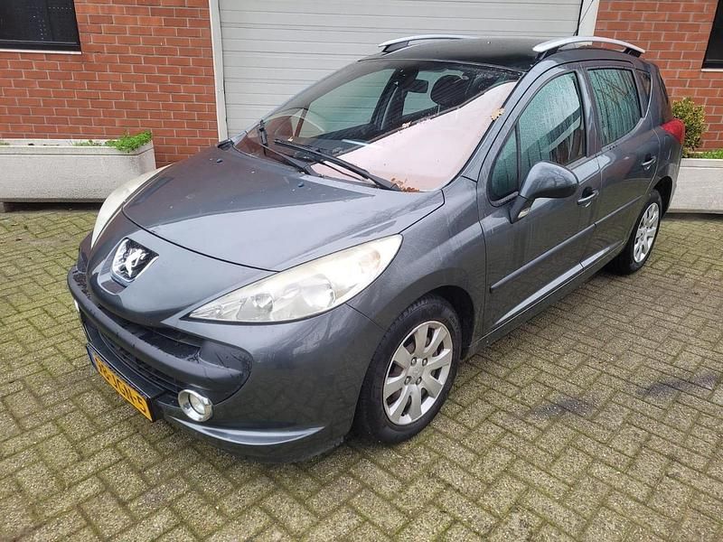 Grijs Gebruikt 2009 Peugeot 207 Stationwagen | € 1.450 (Goede deal) - Afbeelding 1/4