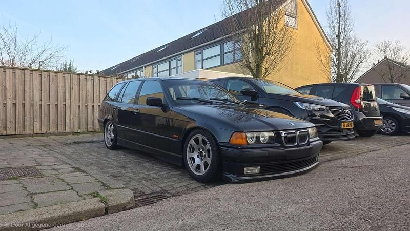 Zwart Occasion 1997 BMW 316 Stationwagen | € 2.500 - Afbeelding 1/4