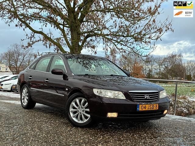 Rood Occasion 2009 Hyundai Grandeur Style Sedan | € 4.975 - Afbeelding 1/4